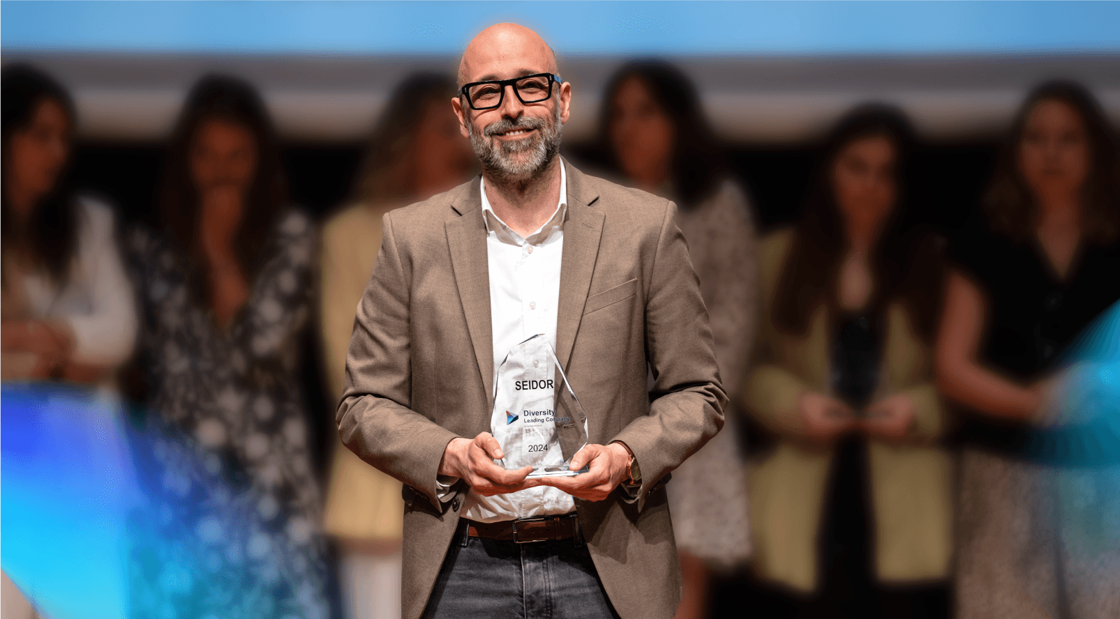 Ivan Gonzalez standing showing an award